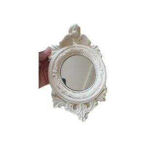Chalkware vintage mirror with cherub design